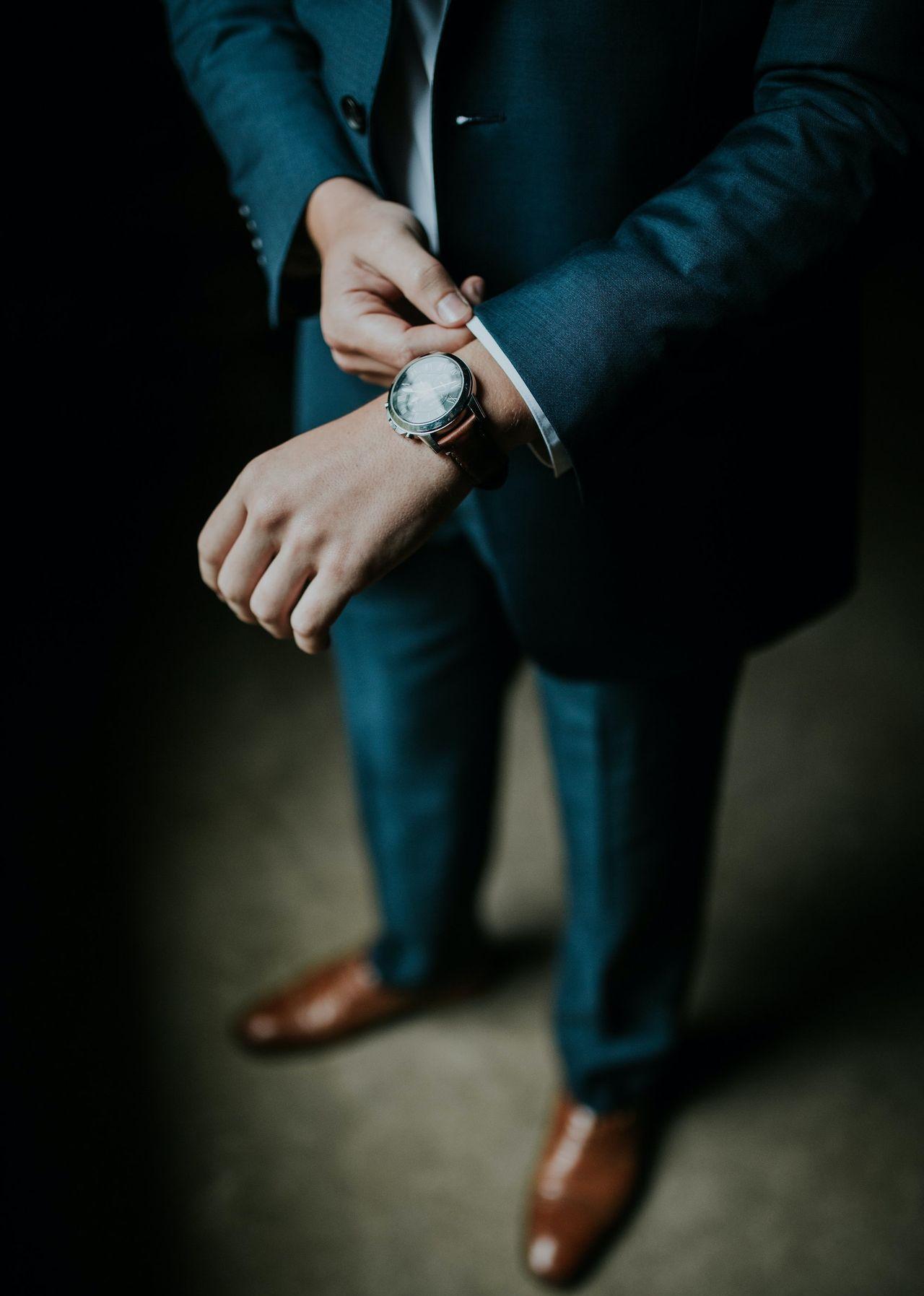 man holding his black suit